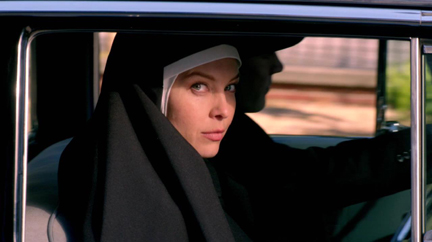 Abaddon give young Julia one last threatening look as she drives away with Henry. Abaddon give young Julia one last threatening look as she drives away with Henry.